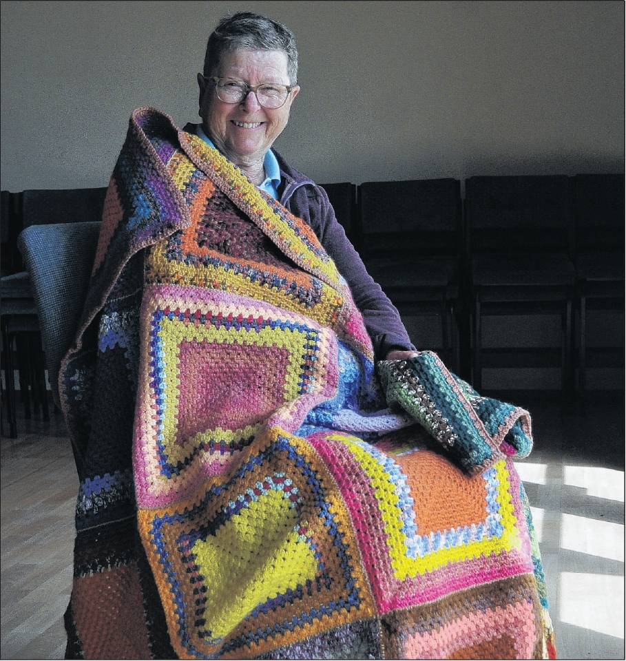 Sheryl Croucher, of Kaiapoi, wrapped in a rug she has crocheted. PHOTO: SHELLEY TOPP