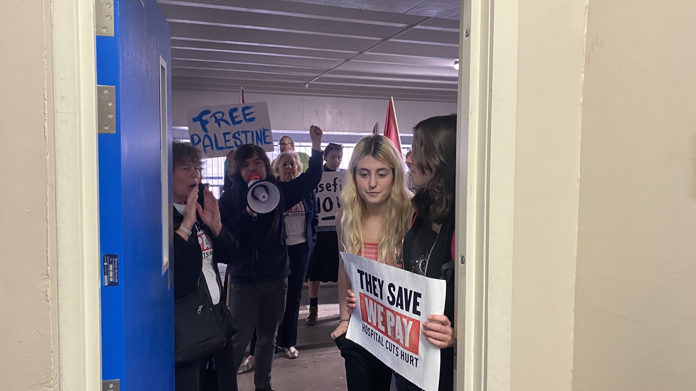 Protesters wait for the Prime Minister at the Civil Defence bunker in Dunedin on Monday. Photo:...