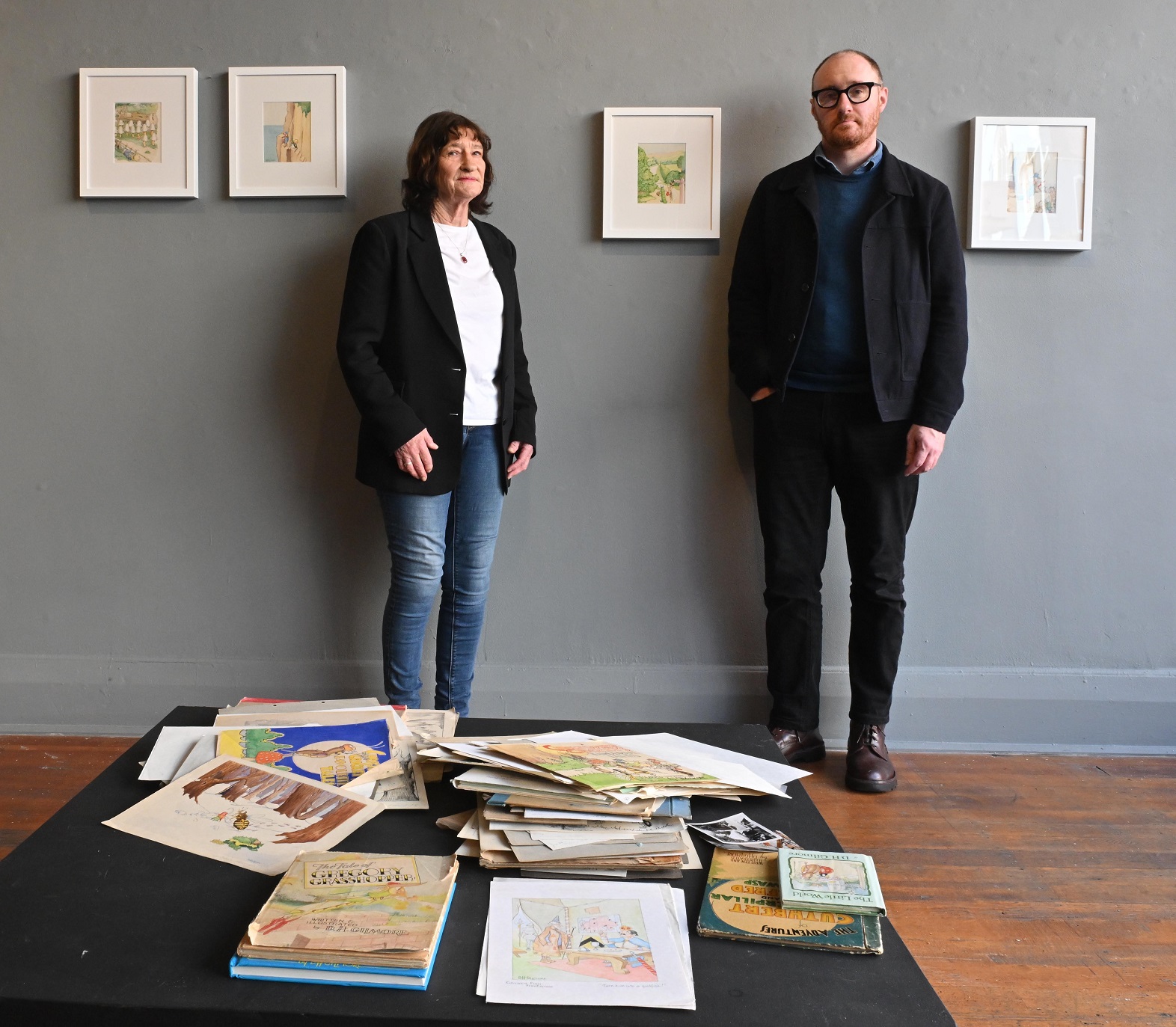 Artist Philip Madill and his mother Helen Gilmore with the drawings her father made for a series...