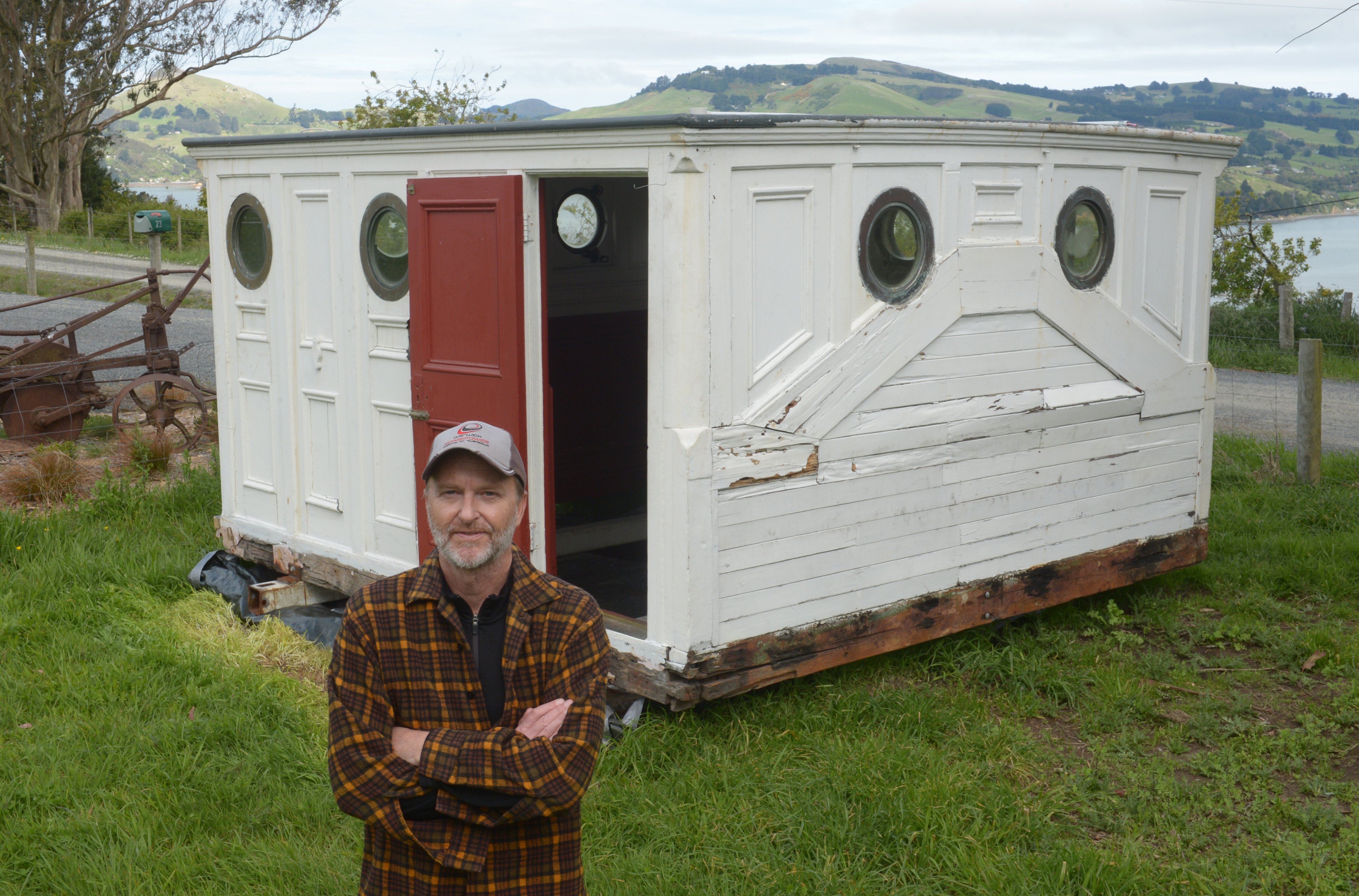 Dunedin writer Quinn Berentson outside his new sleepout/writer’s room, which used to be the...