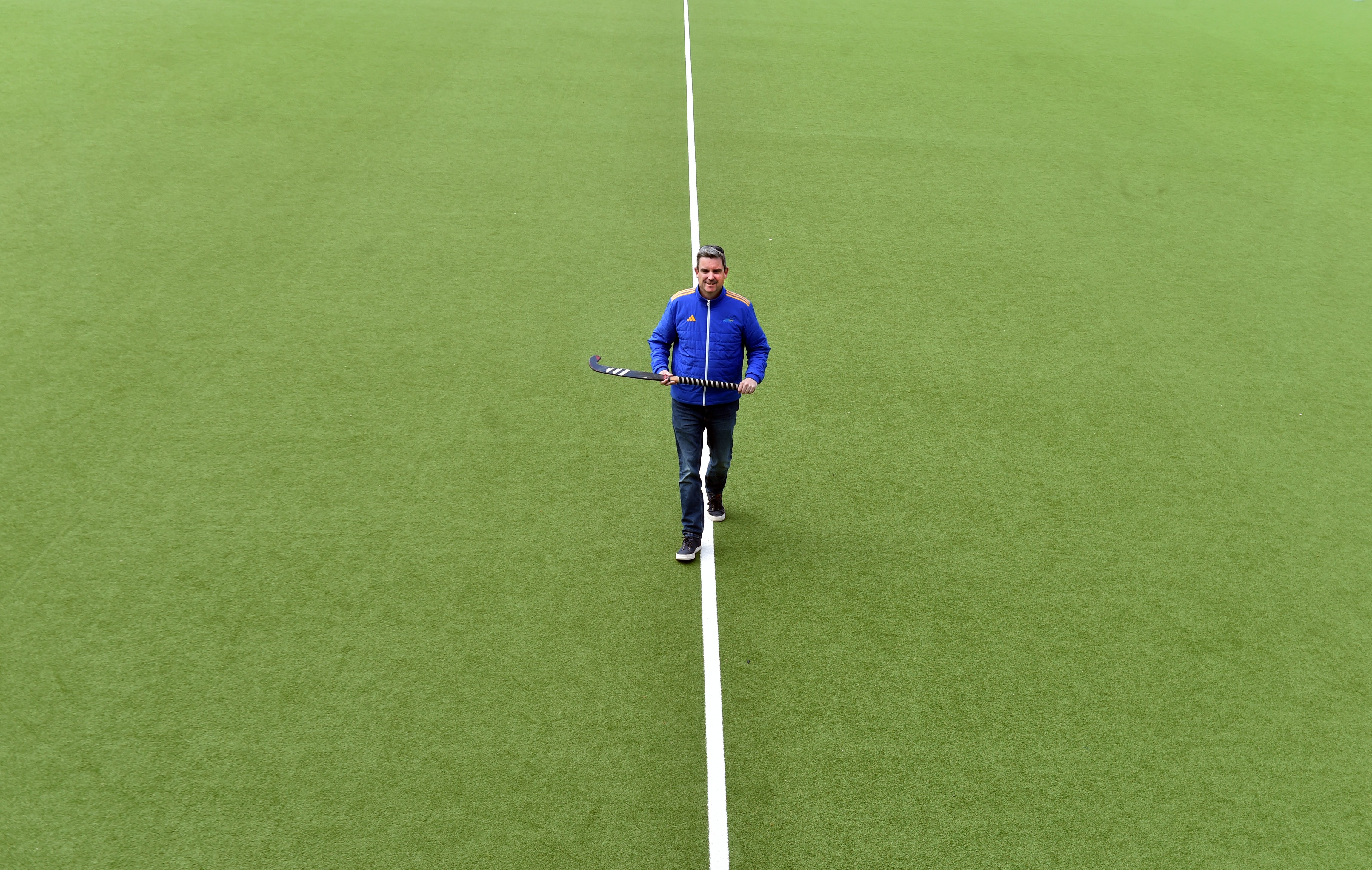 Otago Hockey general manager Andy McLean walks across the soon-to-be replaced artificial turf at...