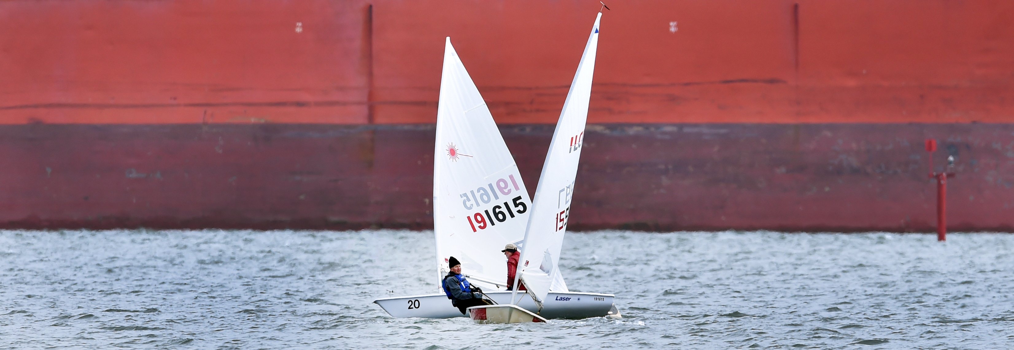 Peter Nees and Bruce Cloughley sail by each other in the combined opening day regatta at the...