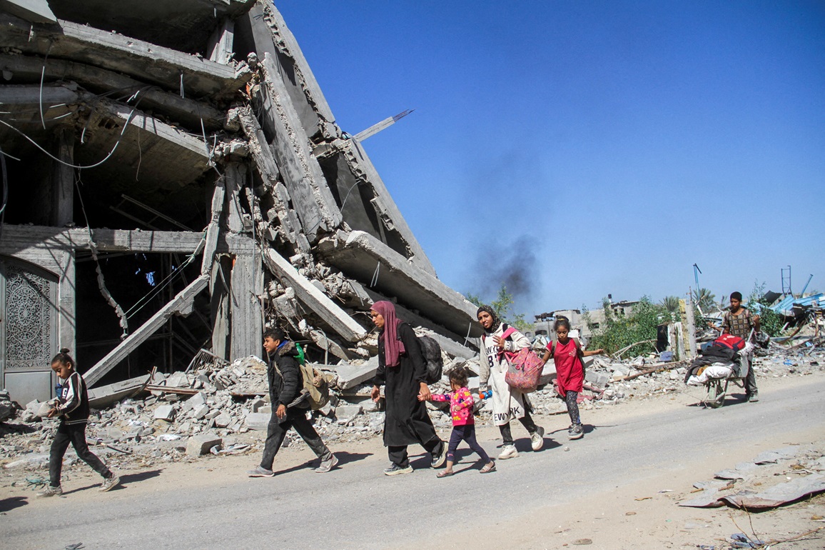 Displaced Palestinians ordered by the Israeli military to evacuate the northern part of Gaza flee...