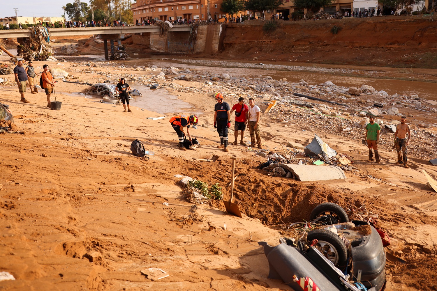 People work on cleaning up after flooding in Paiporta, near Valencia, Spain. Photo: Reuters