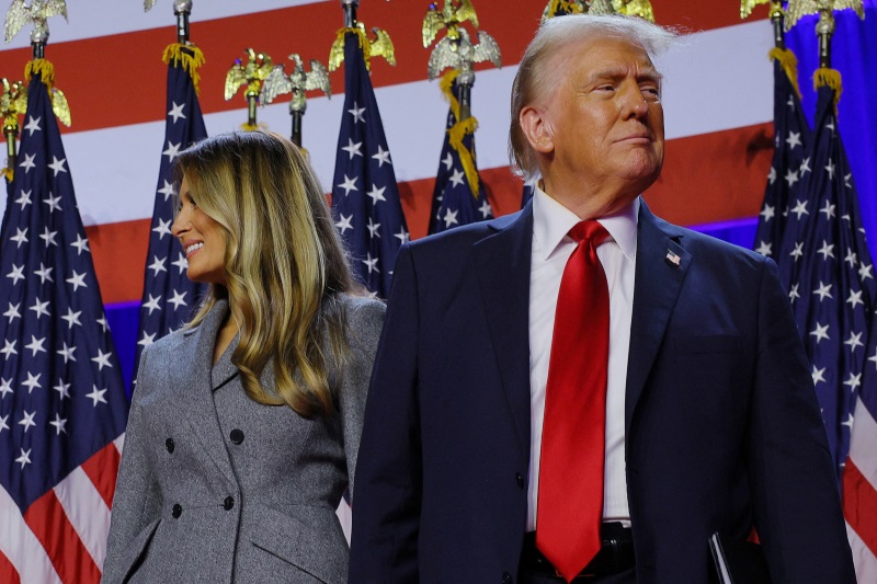 US President Donald Trump is joined onstage by his wife Melania at his election night rally at...