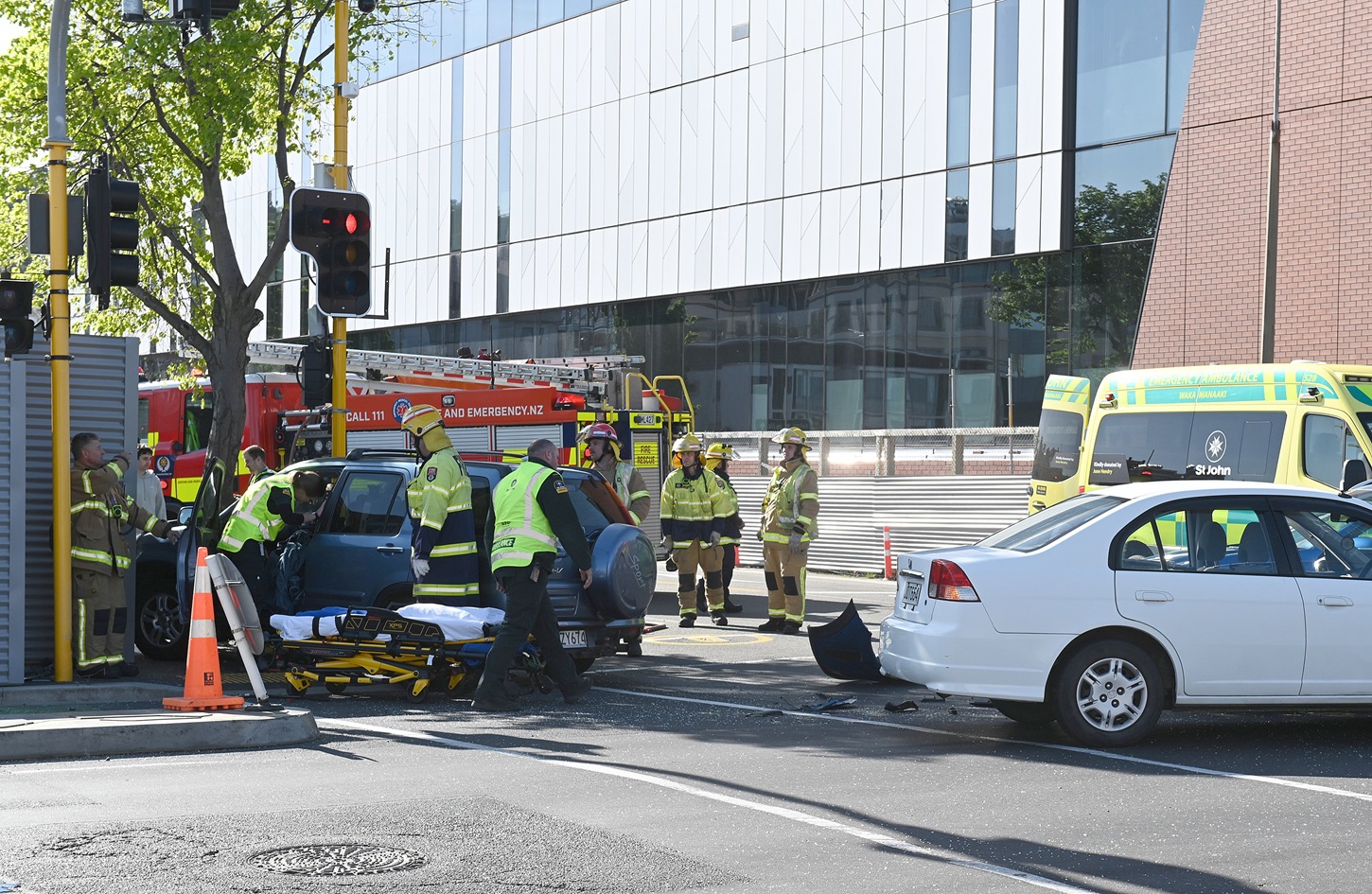 Emergency services at the scene in central Dunedin. Photo: Linda Robertson