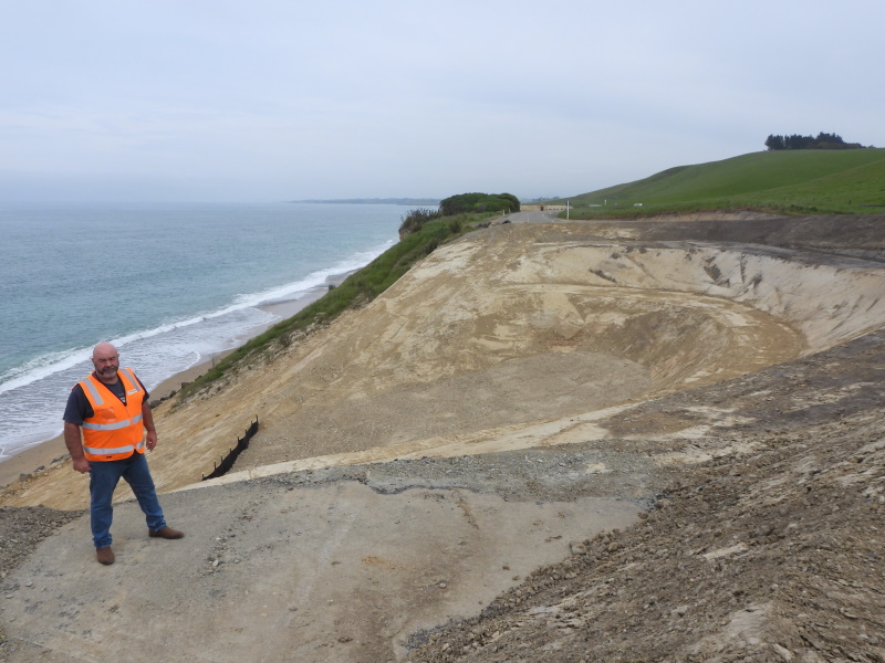 Waitaki District Council solid waste manager Steve Clark stands at the edge of the largest hole...