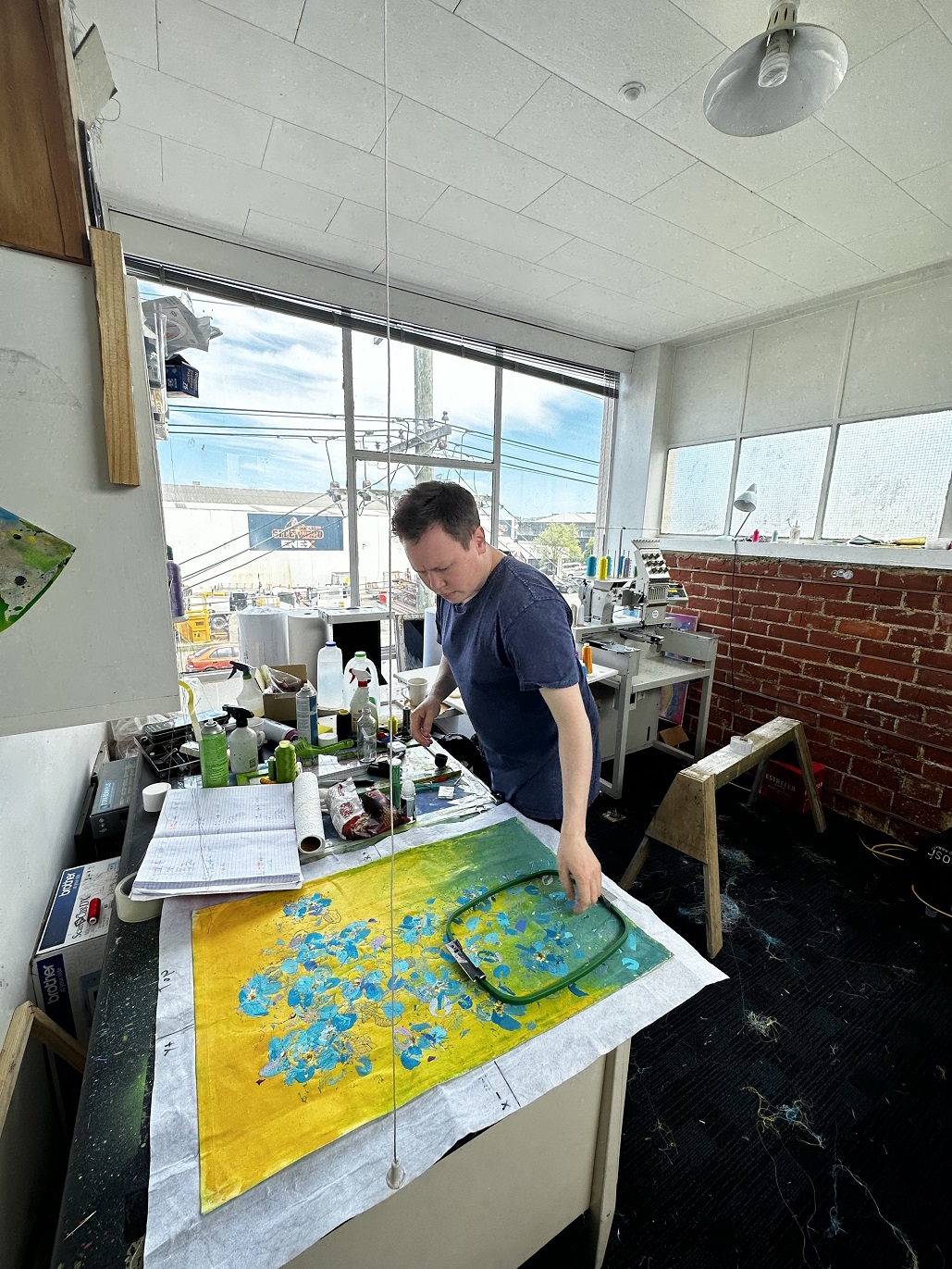 Artist Benjamin Sargeant, aka uou.label, puts the finishing touches on a canvas in his Dunedin...