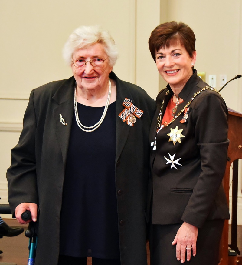 Doreen Tucker receives her QSM for services to netball from then governor-general Dame Patsy...