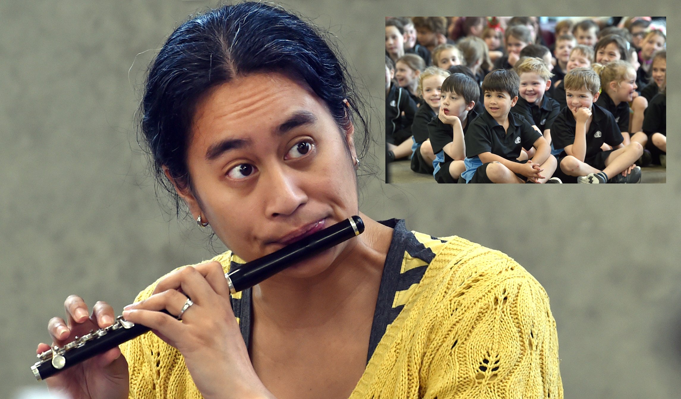 Dunedin Symphony Orchestra education liaison and flute player Feby Idrus plays the piccolo flute...