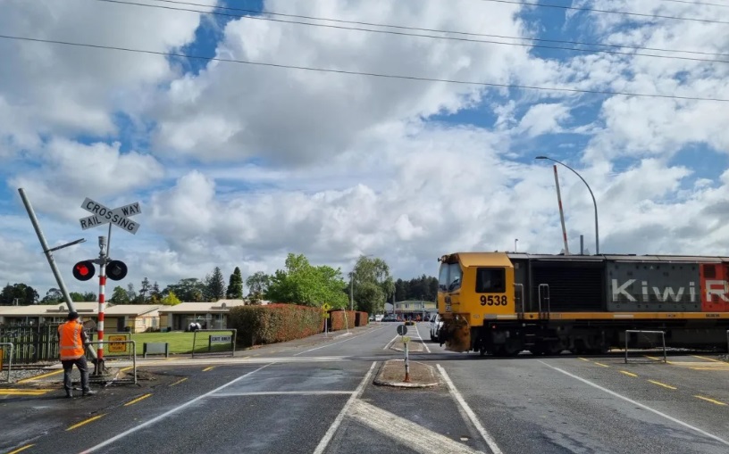 Officials at the site of the car and train crash in Hamilton. Photo: RNZ 