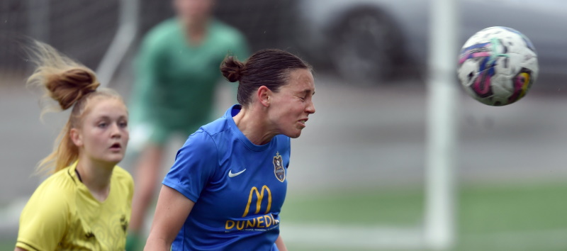 Southern United midfielder Stacey Martin heads the ball during their game at Logan Park Turf last...