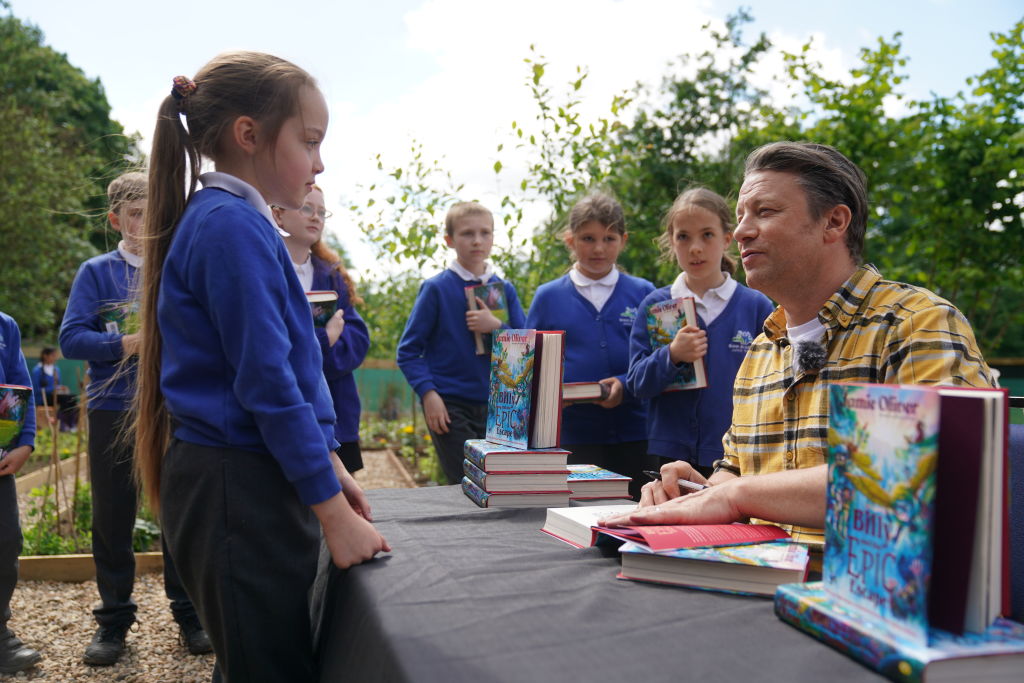 Jamie Oliver signs copies of his book 'Billy and the Epic Escape' during a visit to Great...