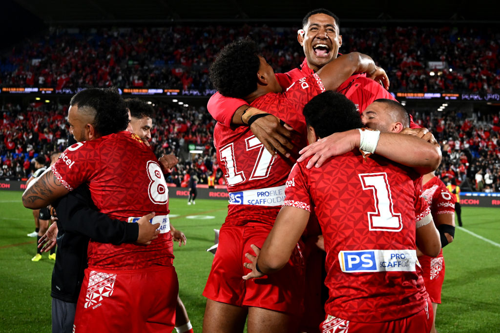 Tongan players celebrate their victory over the Kiwis at Mt Smart Stadium. Photo: Getty