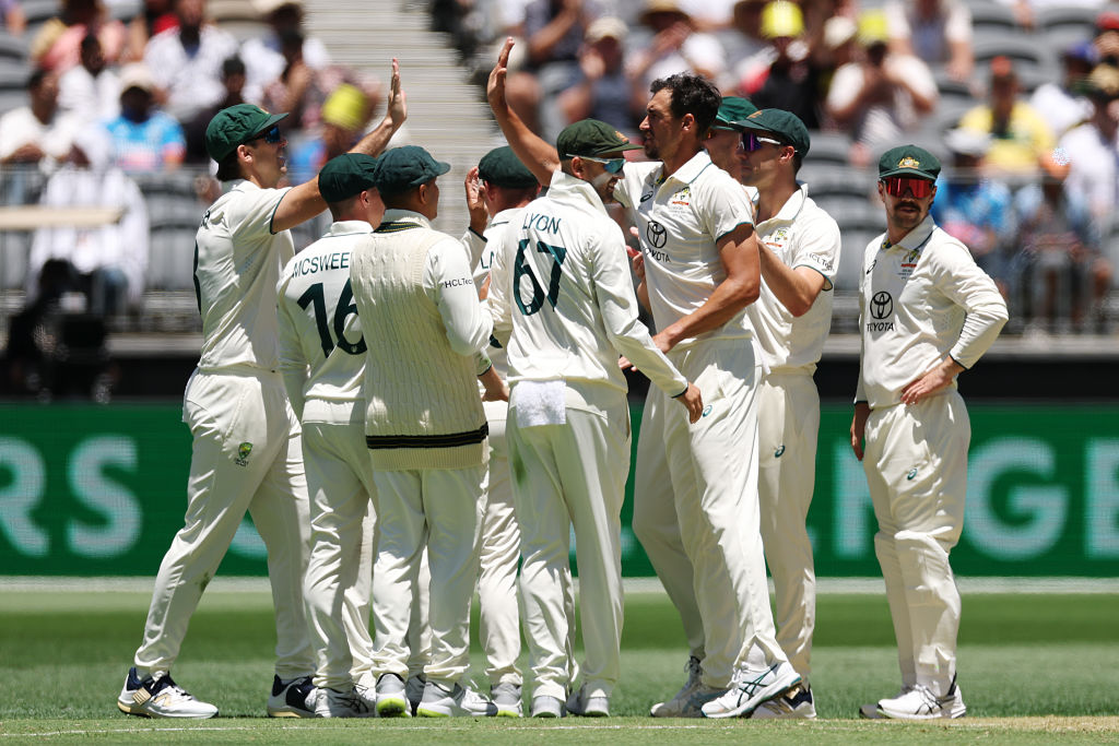 Australia players celebrate the wicket of KL Rahul during the opening session of the first test...