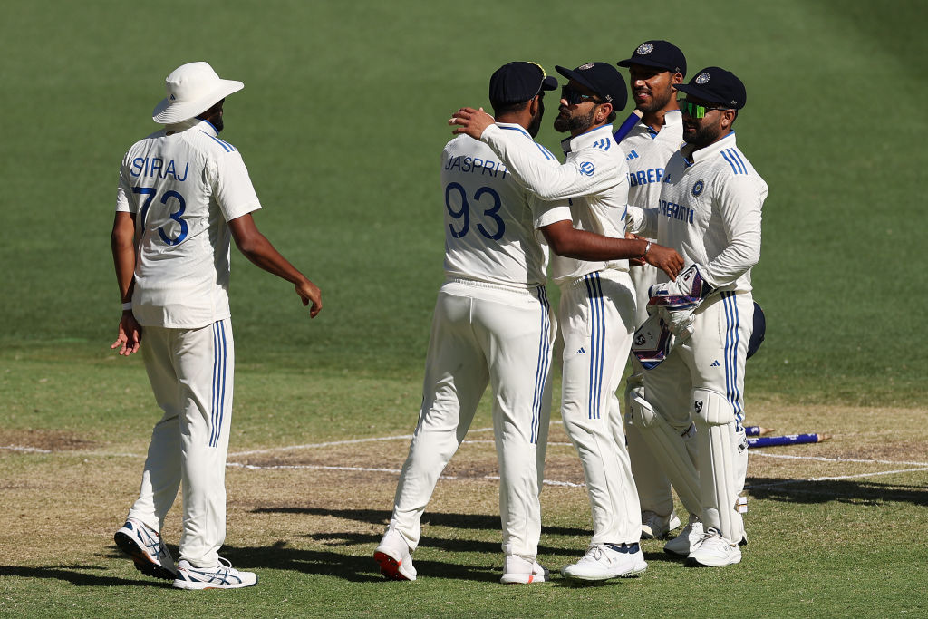 Virat Kohli and Jasprit Bumrah of India celebrate a wicket as on their way to clinching the first...