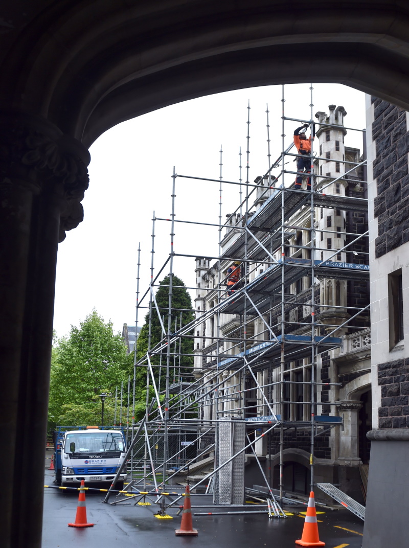 Scaffolders erect scaffolding around the University of Otago’s Marama Hall, in preparation for...