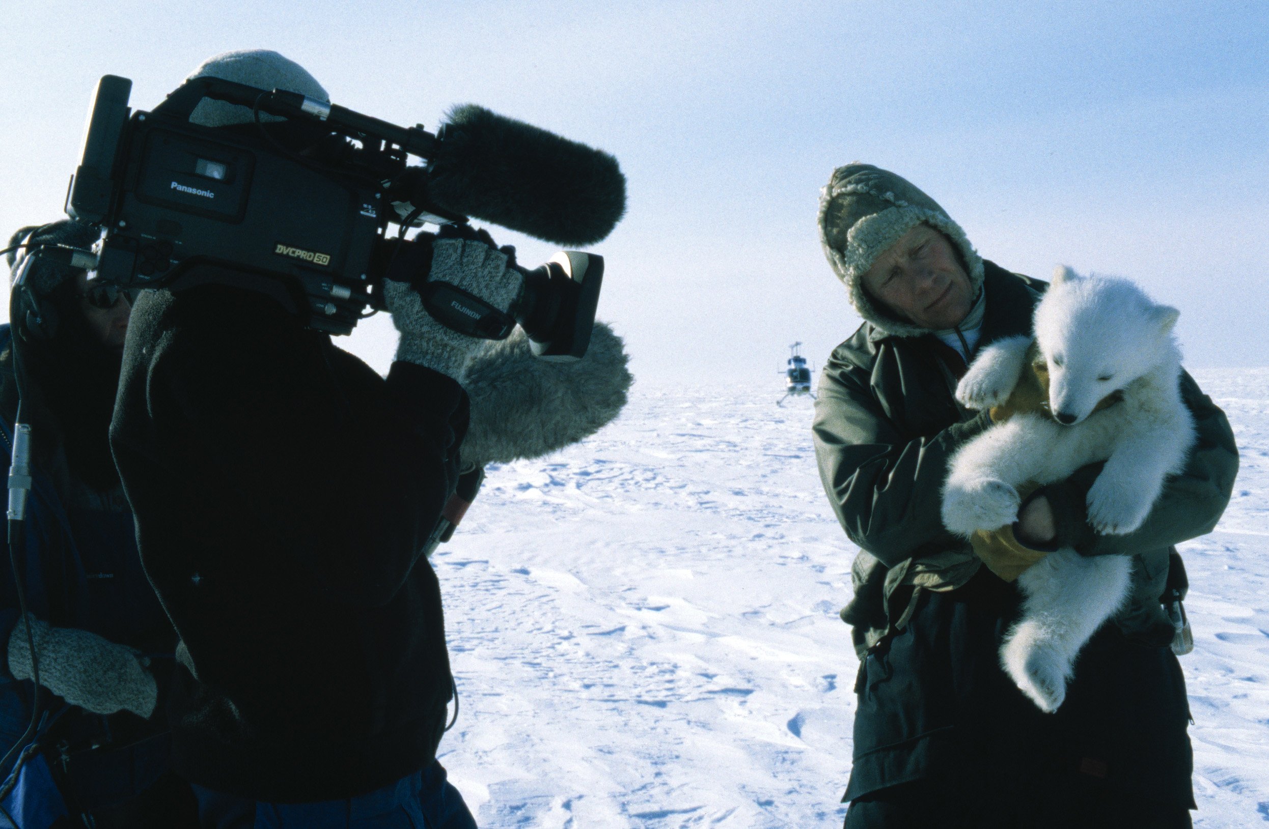 Max Quinn films Dr Steven Amstrup with a polar bear cub.