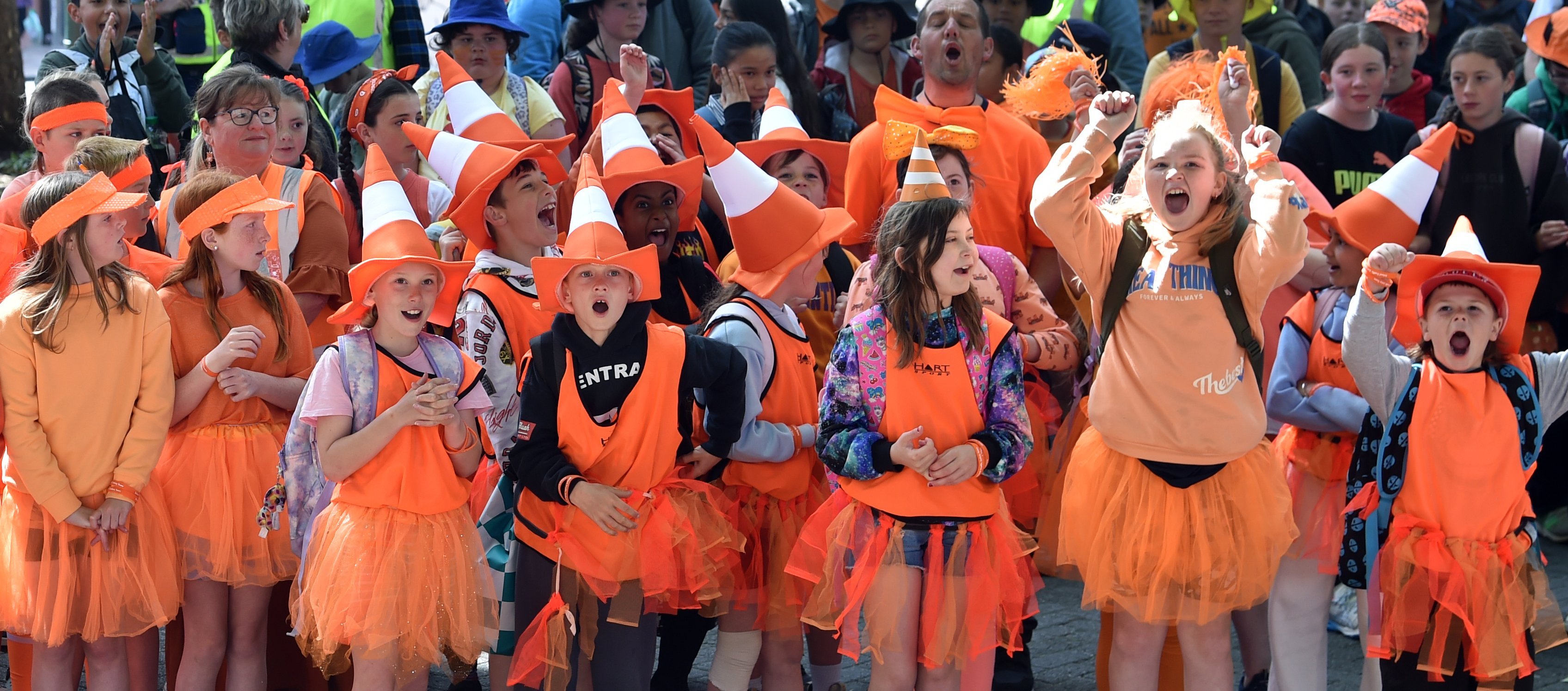 School pupils cheer as their names are called out at the Orange Day parade. PHOTO: PETER MCINTOSH