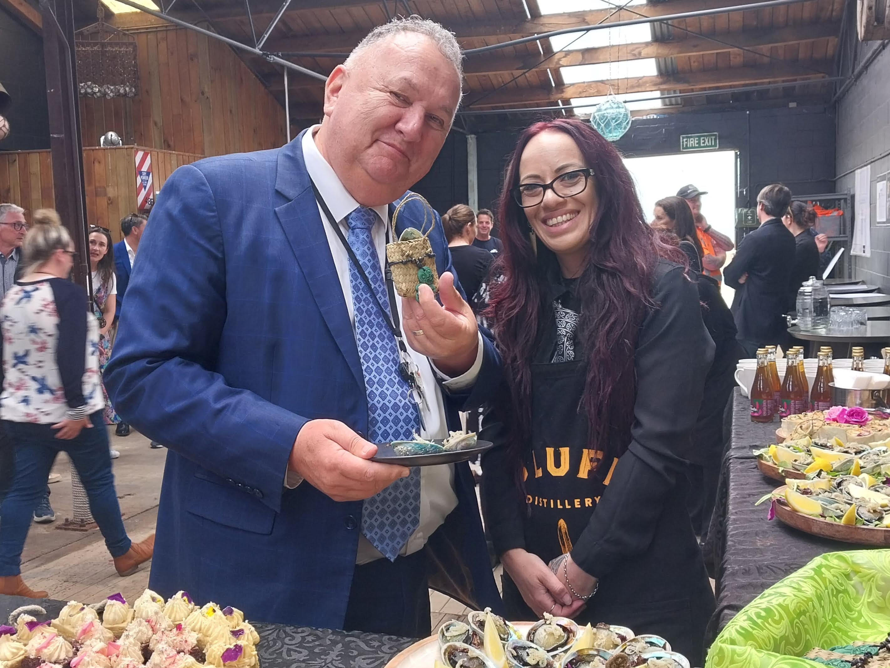 Regional Development Minister Shane Jones receives a koha from Bluff chef Haylee Simeon while he...