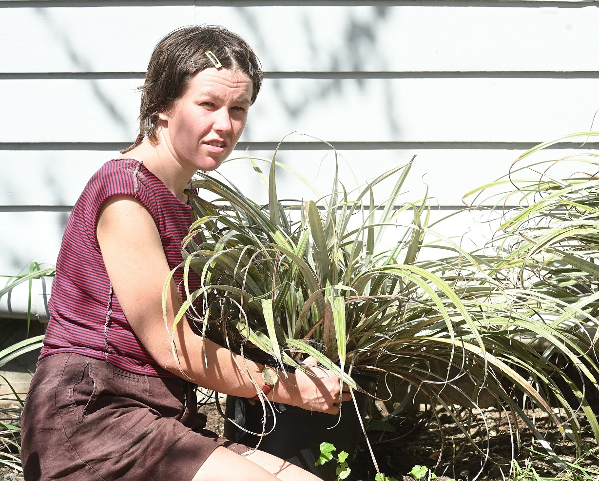 Lucy Hill, 23, works in the garden she plans to move inside for her "Site" installation at the...