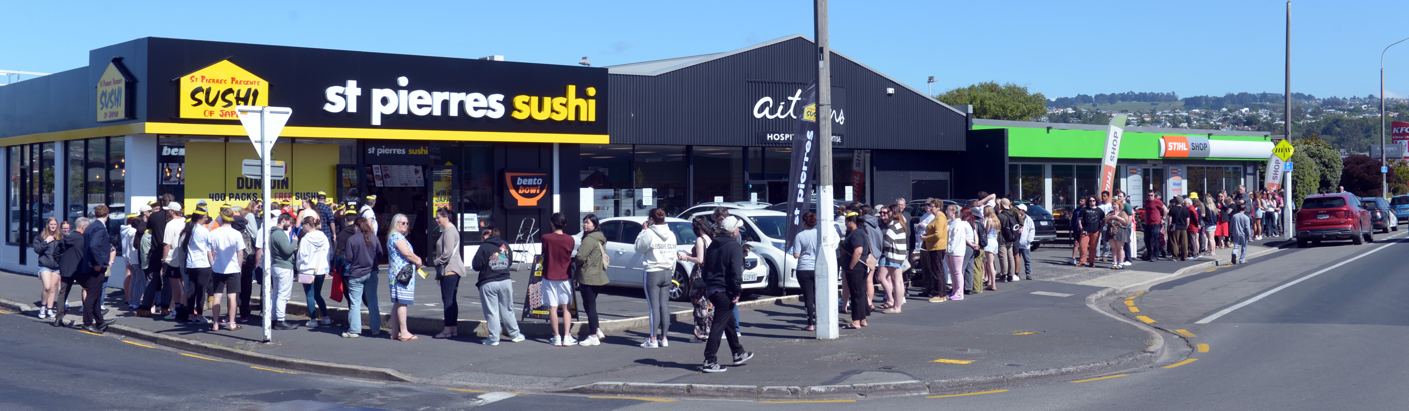 Customers queue outside the new St Pierres store, at the corner of Andersons Bay and Bay View Rds...