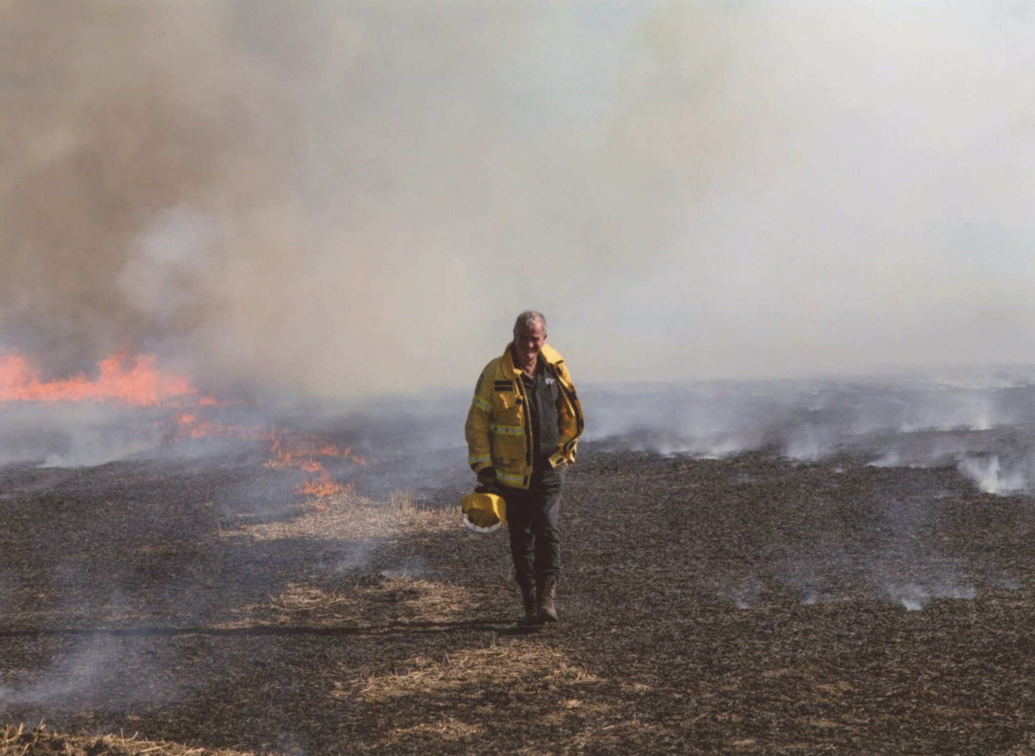 Emerging from the smoke of a forestry fire — Graeme Still during his later career. Photo: supplied