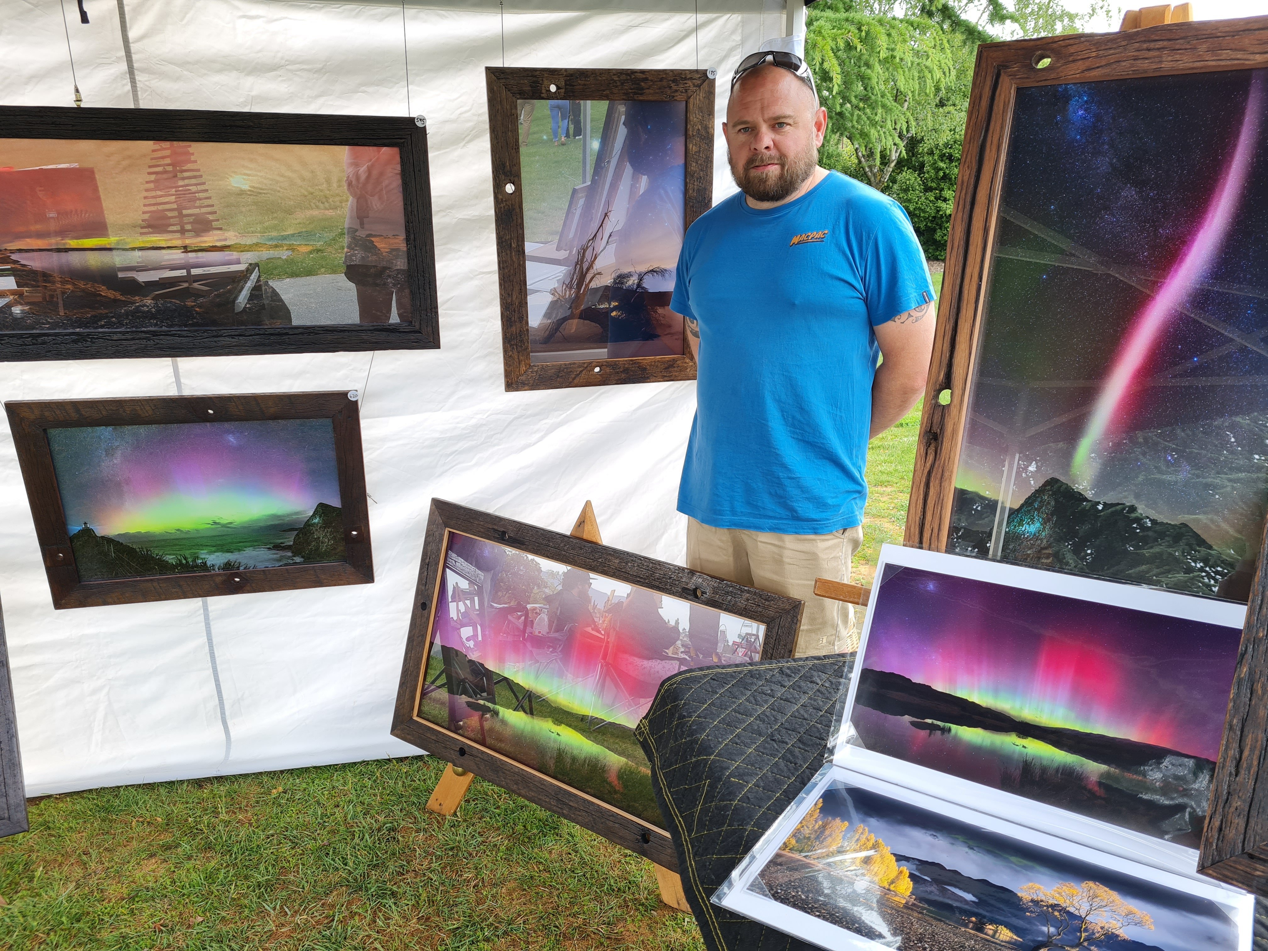 Wānaka photographer and woodwork artist Tristian McDonald stands in his display at the weekly...