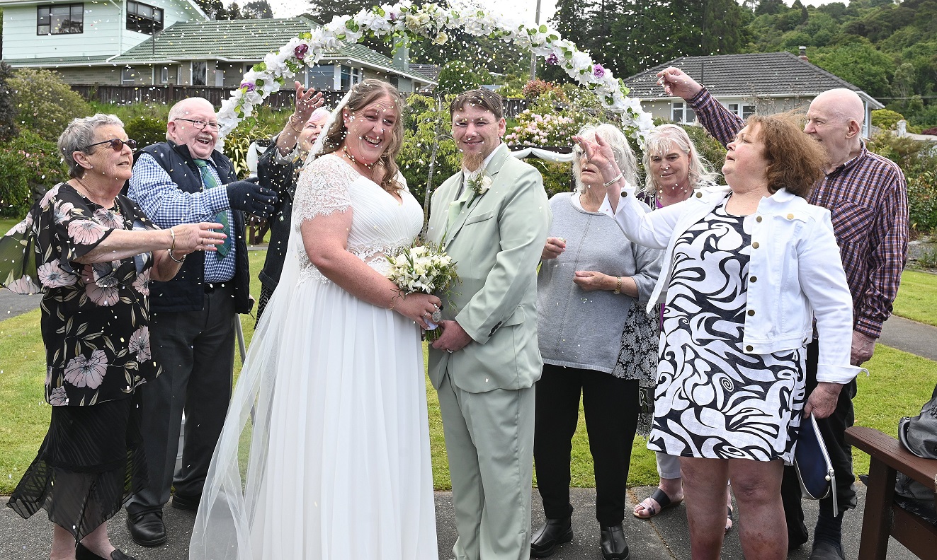 Amanda and Cam Serong-Welch celebrate their wedding yesterday with some of the residents of...