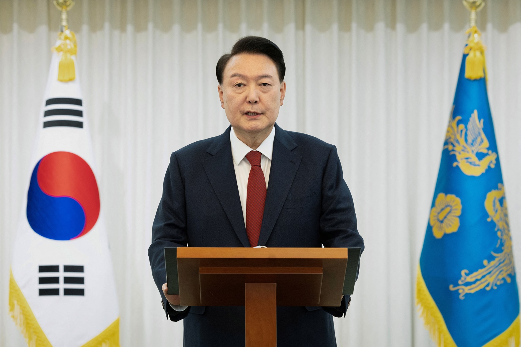 South Korean President Yoon Suk Yeol delivers an address to the nation at his official residence...