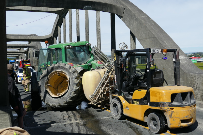 Wide load ... A dual-wheel tractor awaits removal following an accident on the Balclutha Bridge,...