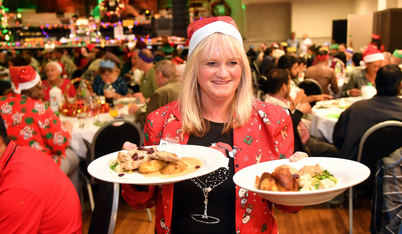 Volunteer Paula Peat serves food at the Dunedin Community Christmas Dinner yesterday. Photos:...