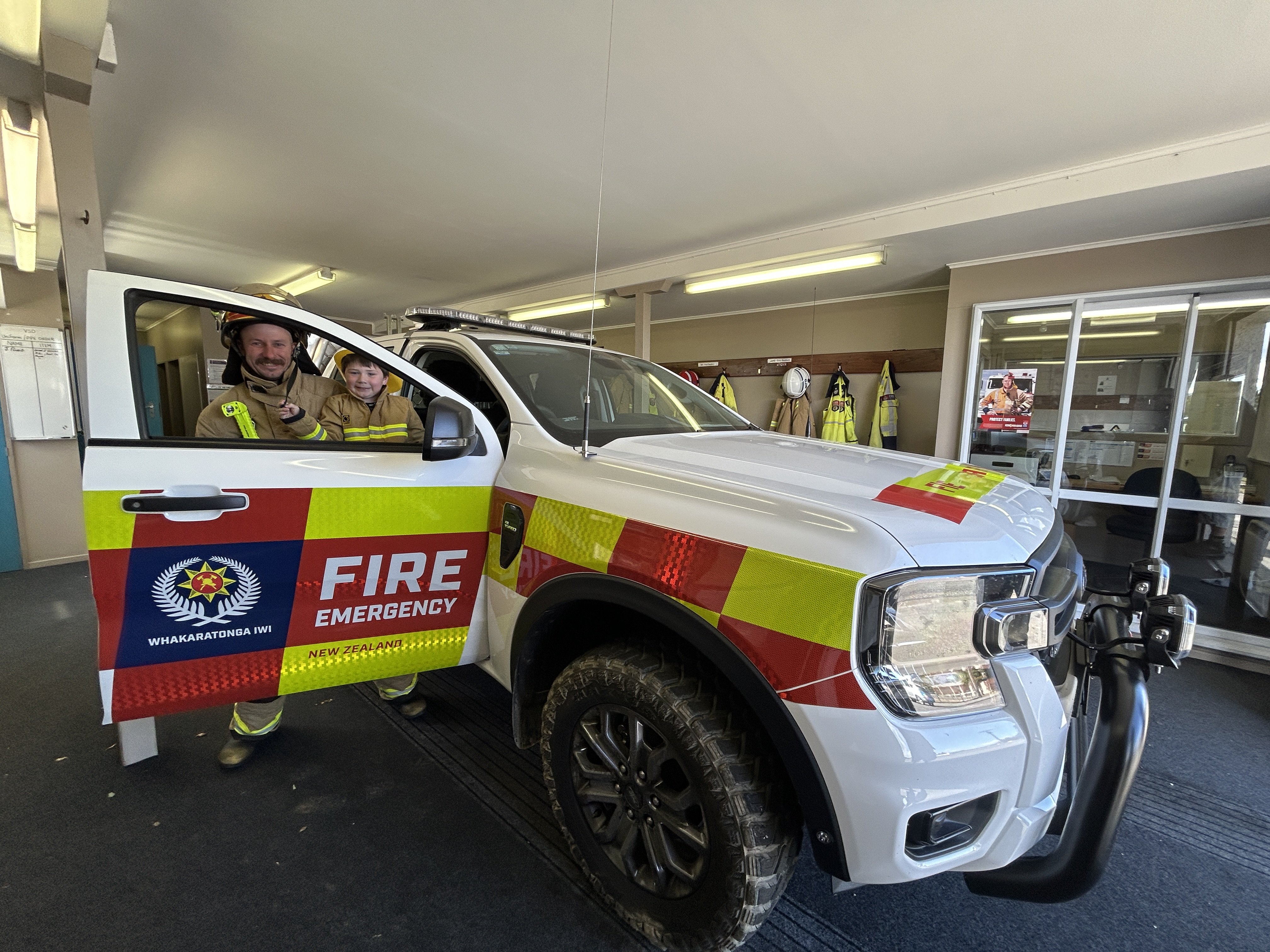 Ranfurly senior firefighter Adam Becker and his son, future firefighter Thomas, 4, check out the...