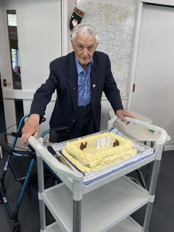 Century and change ... Les Roughan cutting his birthday cake at his celebration at Resthaven...