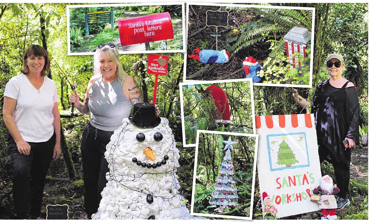 Tinsel Trail committee members Vicky Weller (left) and Chanelle Purser admire a snowman while...