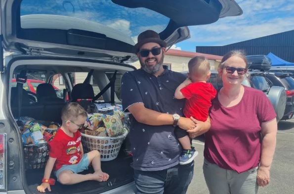 Paul Kumar, with partner Jo, and children Elias and Amos were picking up a Christmas hamper to...