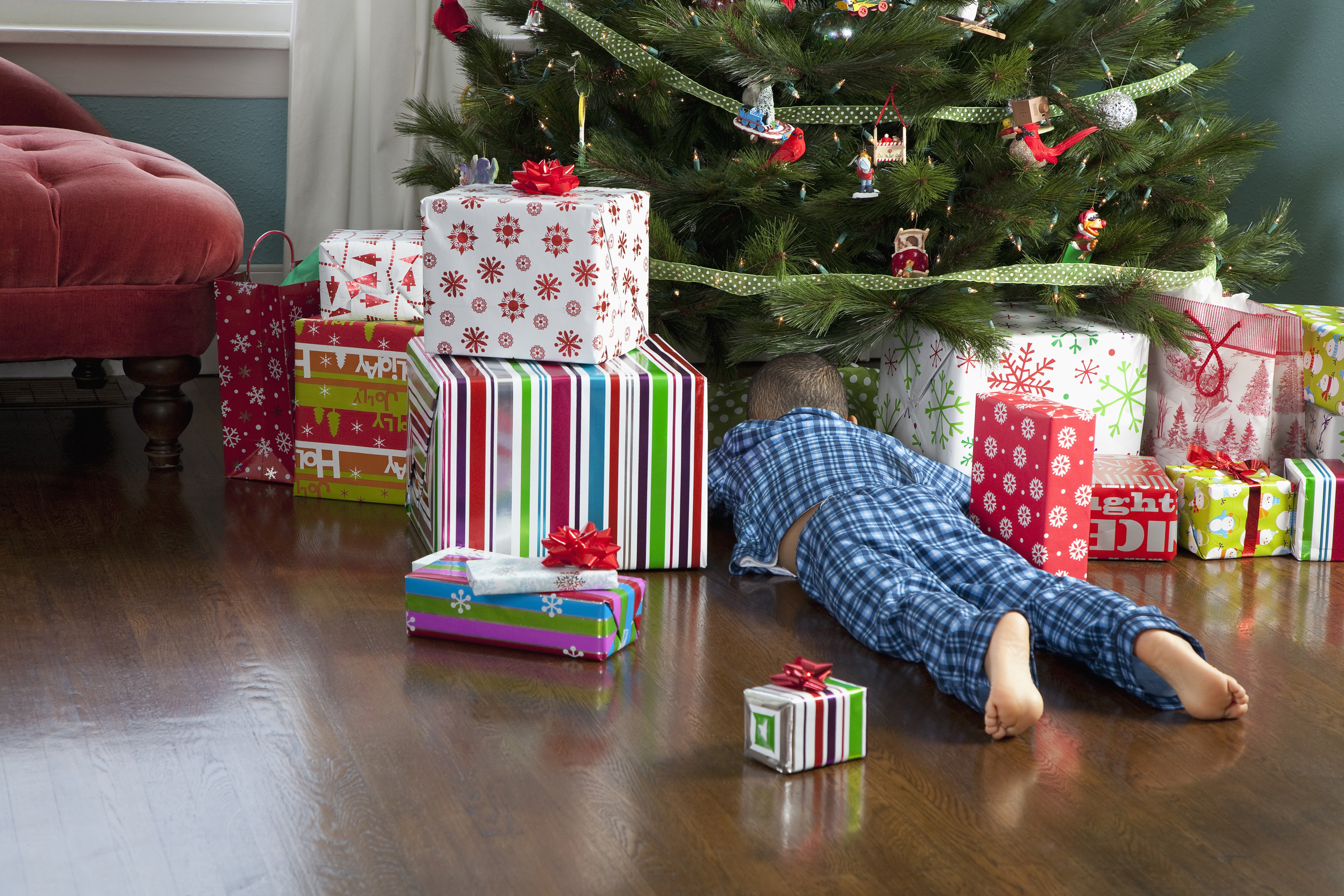 Ah, to be a child at Christmas, waiting to unwrap the presents under the tree. PHOTO: GETTY IMAGES