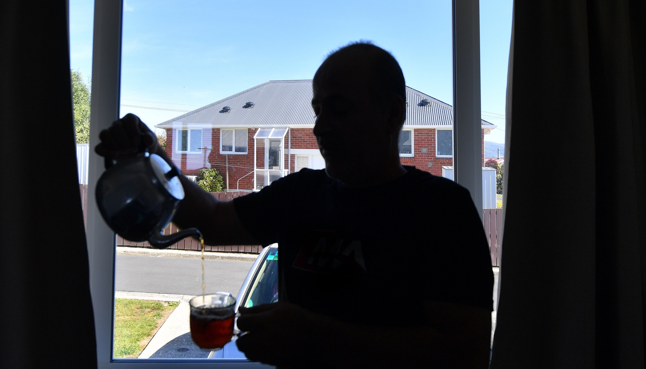 Ali, finally in a warm and safe Kāinga Ora unit — the house he had longed for.