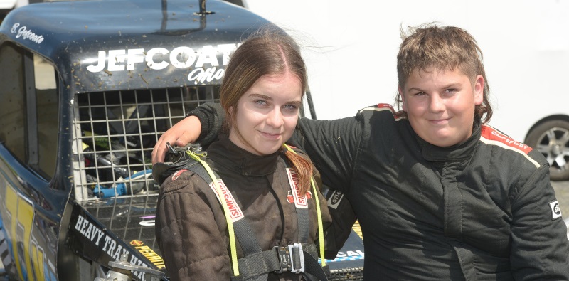 Sibling ministock racers Leilah, 16, and Bailey, 12, Jeffcoate lean on each other after racing at...