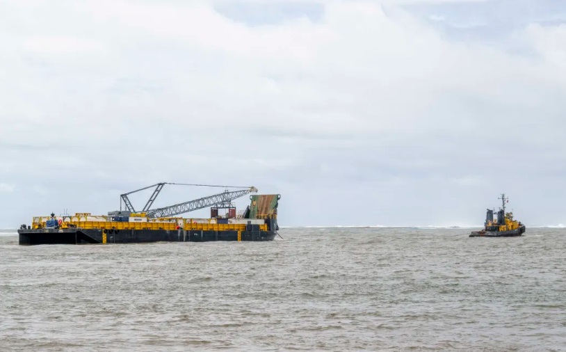 The barge as it was leaving the port of Apia for coast area of Samoa where the Manawanui sunk....