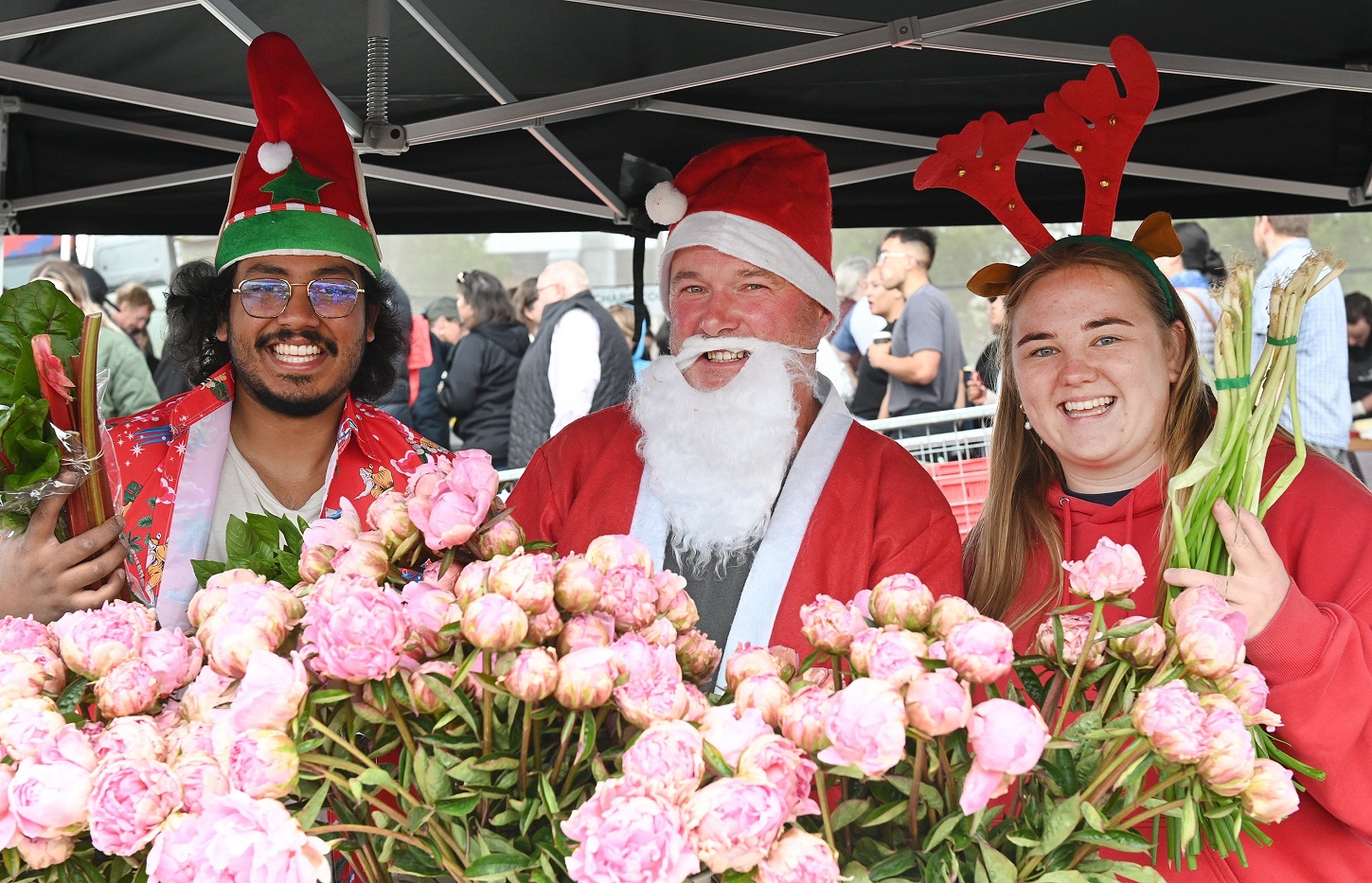 Janefield Peonies and Hydroponics stall operators (from left) Mueed Hasan, Rodger Whitson and...