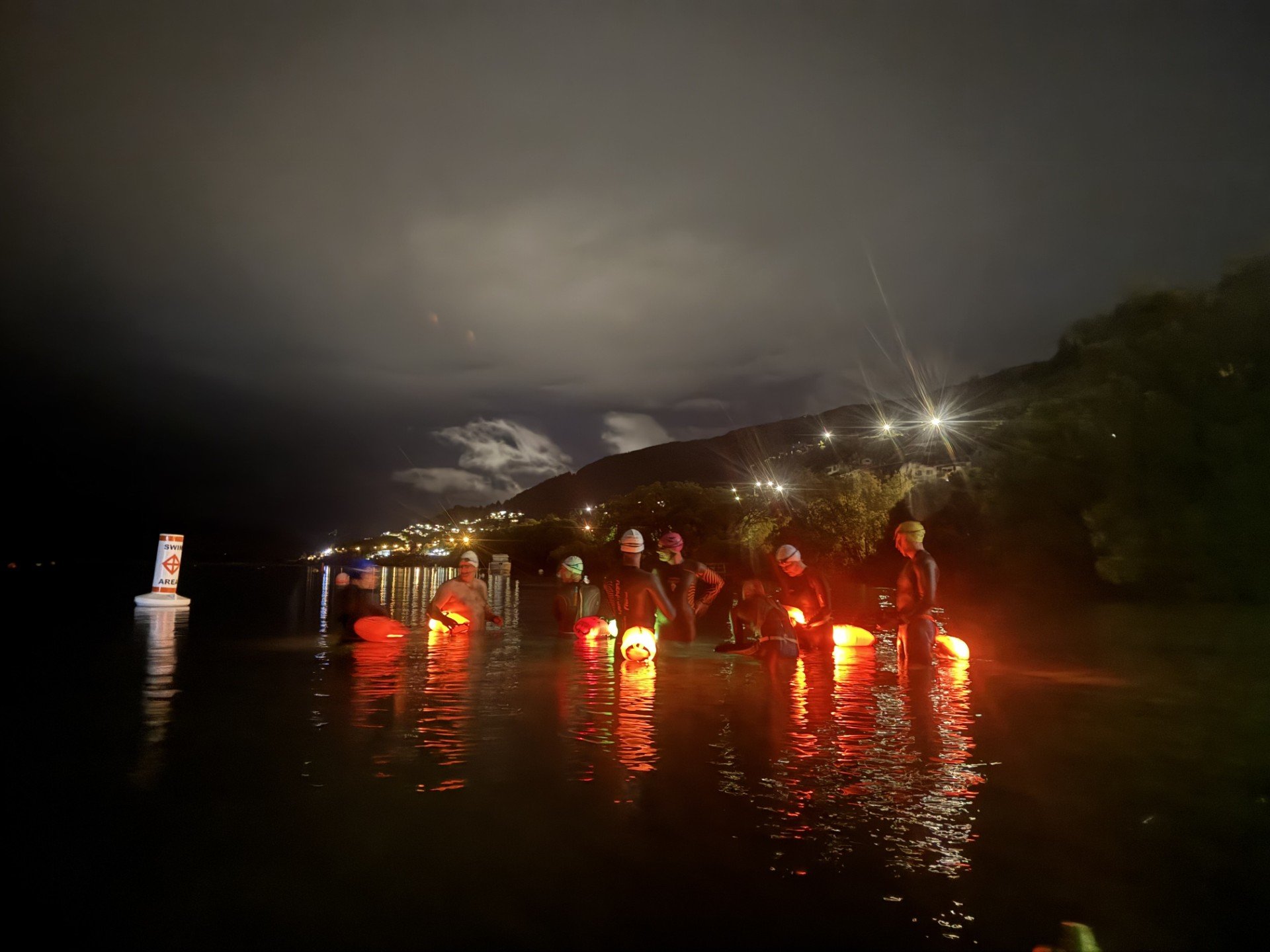 embers of the Southern Lakes Swimming Club prepare to take part in the summer solstice swim in...