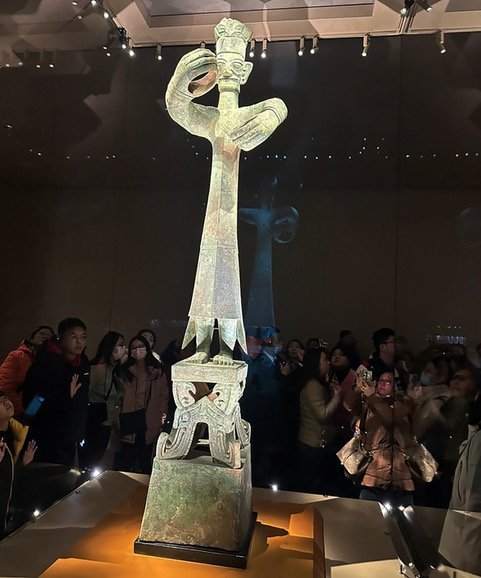 The shaman king of Sanxingdui stands over 3m, dwarfing the crowd of visitors to the museum....