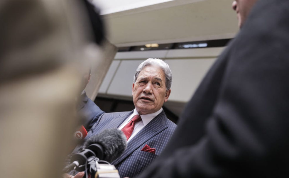 NZ First leader Winston Peters speaks to media after emerging from his party's temporary offices...