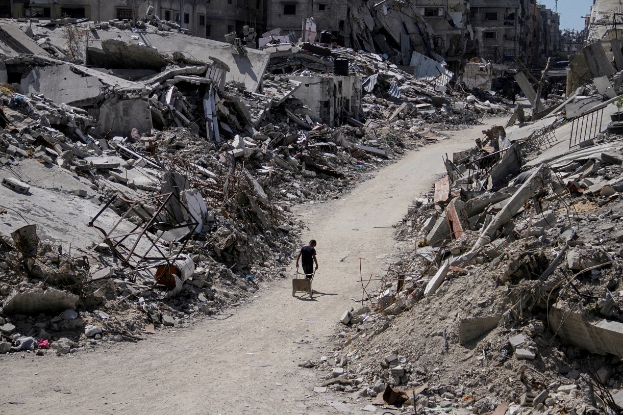 A Palestinian walks through the rubble of Gaza. Photo: Reuters