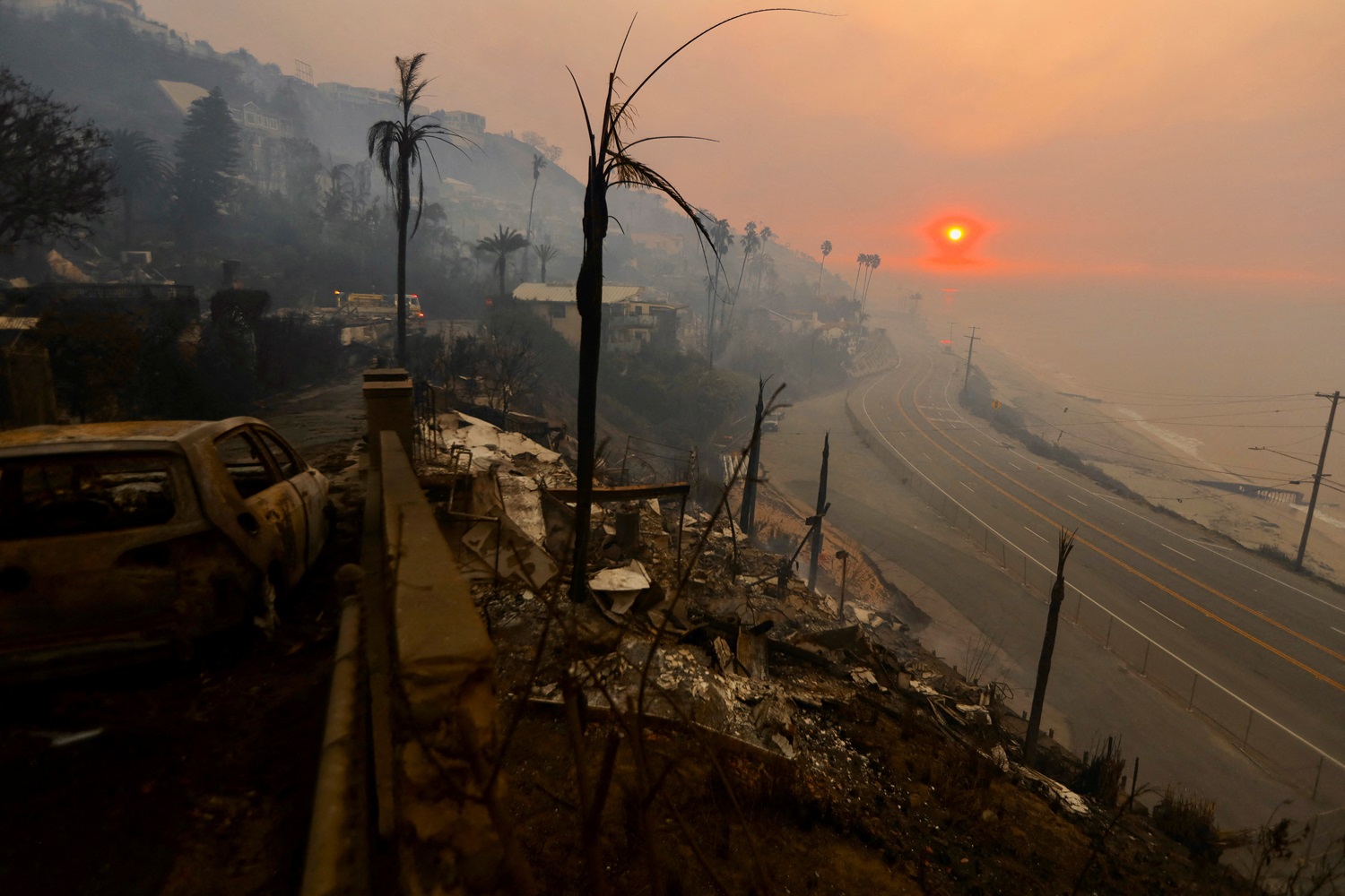 The sun rises over the Pacific Palisades neighbourhood of west Los Angeles, showing devastation...