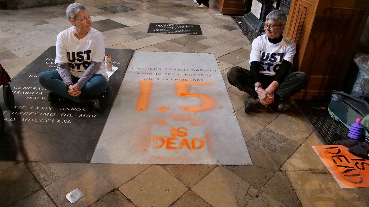 Climate activists from 'Just Stop Oil' sit in protest after painting over the grave of Charles...