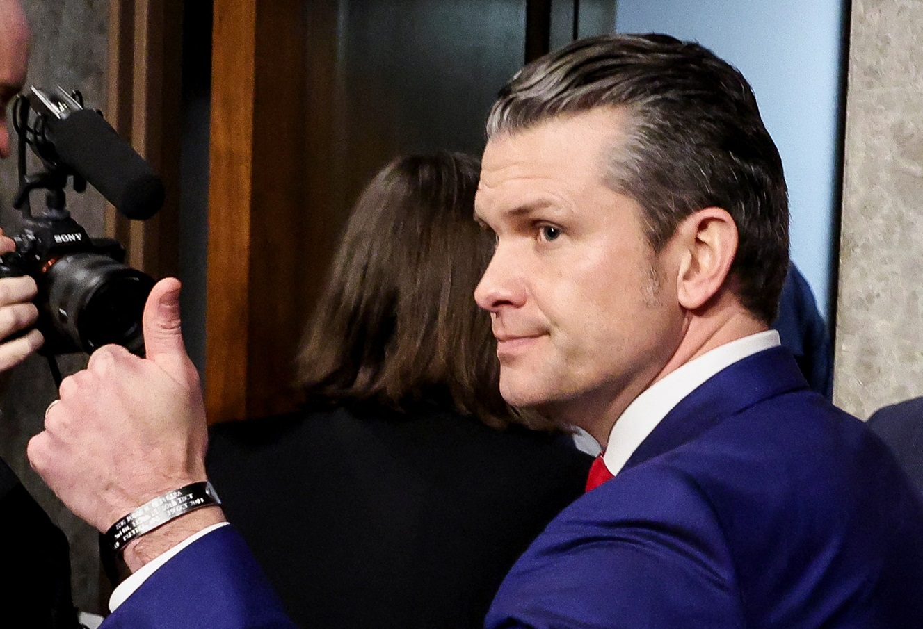 Pete Hegseth gives a thumbs-up as he leaves a Senate Committee on Armed Services confirmation...