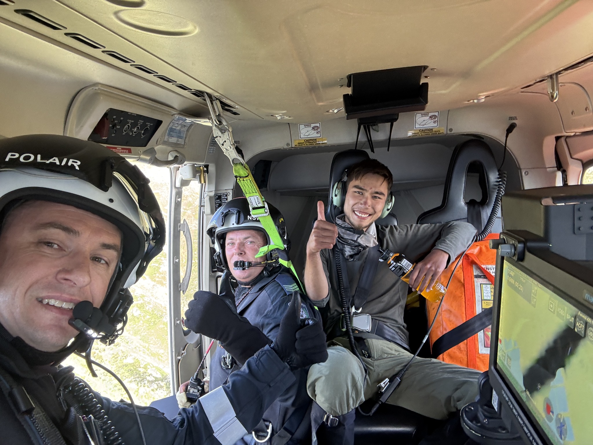 Hadi Nazari in the helicopter after being rescued following 13 days missing in the mountains....