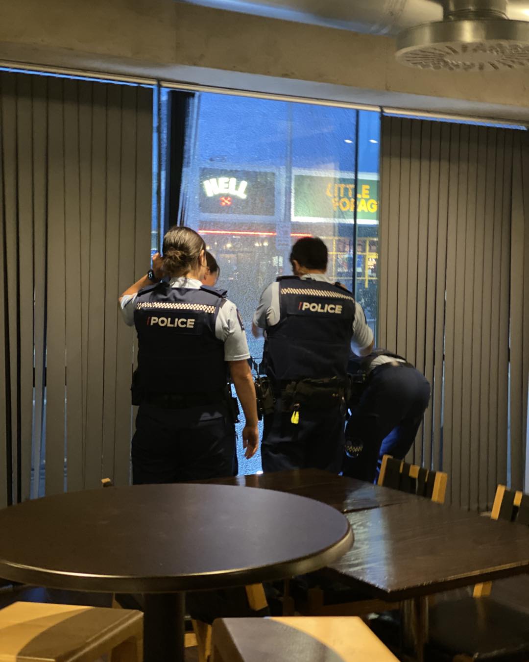 Police examine the window at Tony's Teppanyaki Restaurant in Riccarton. Photo: Facebook